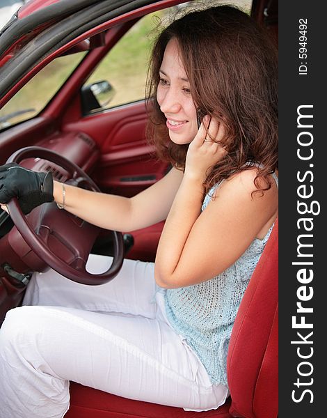 Woman With Phone In Car