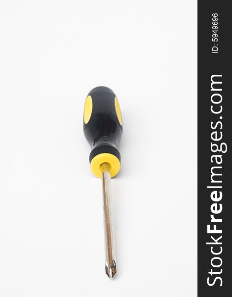 Yellow and black handled phillips screwdriver on white background. Yellow and black handled phillips screwdriver on white background