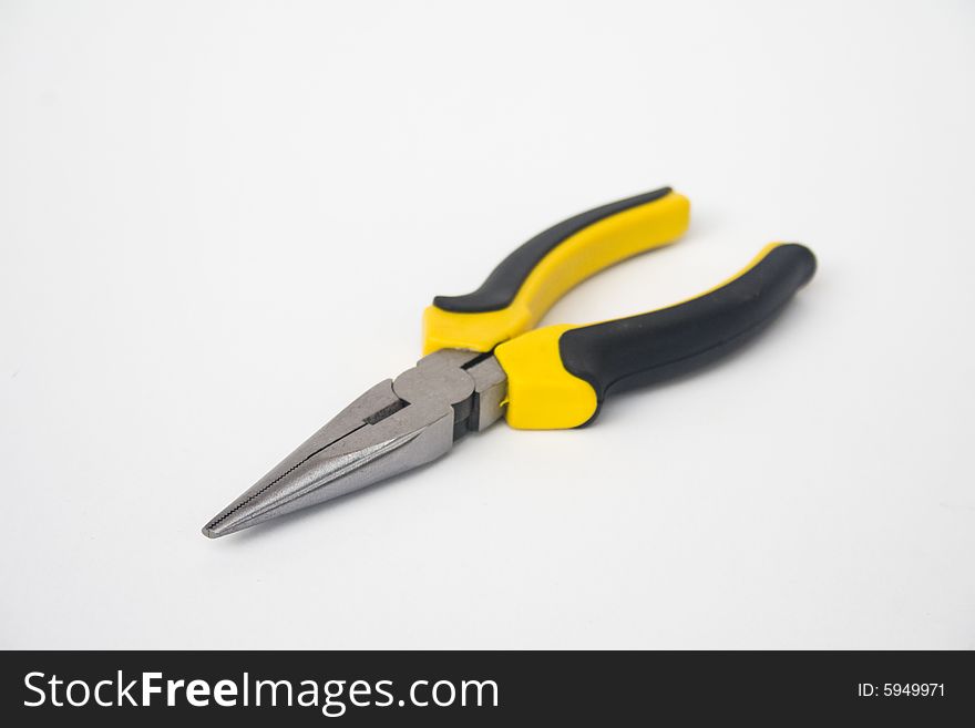 Yellow and black handled needle nose pliers against a white background