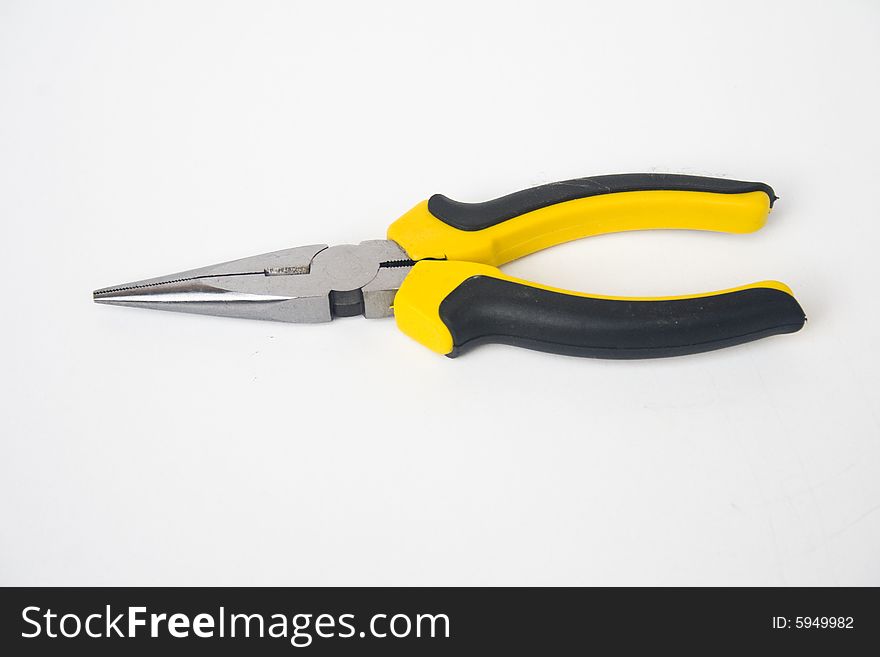 Yellow and black handled needle nose pliers against a white background