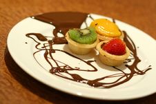 Fruit Tarts With Chocolate Drizzled On Plate Royalty Free Stock Image Fruit Tarts With Chocolate Drizzled On Plate Royalty Free Stock Image