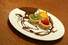 Fruit Tarts With Chocolate Drizzled On Plate Royalty Free Stock Photos Fruit Tarts With Chocolate Drizzled On Plate Royalty Free Stock Photos