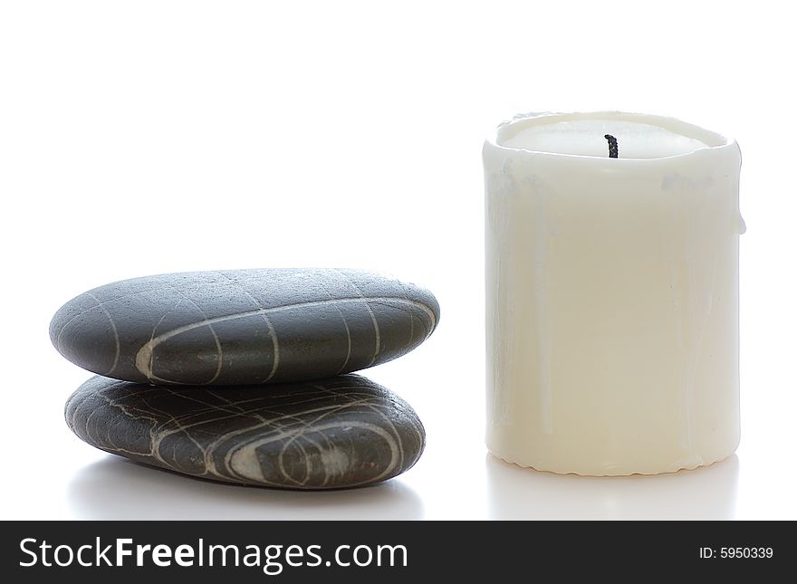 Spa stones with white candle. Spa stones with white candle