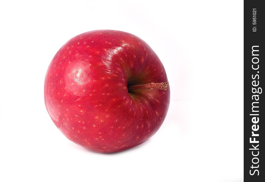 A red Jona gold apple on a white background. Foto taken from a 2/3 perspective. A red Jona gold apple on a white background. Foto taken from a 2/3 perspective.