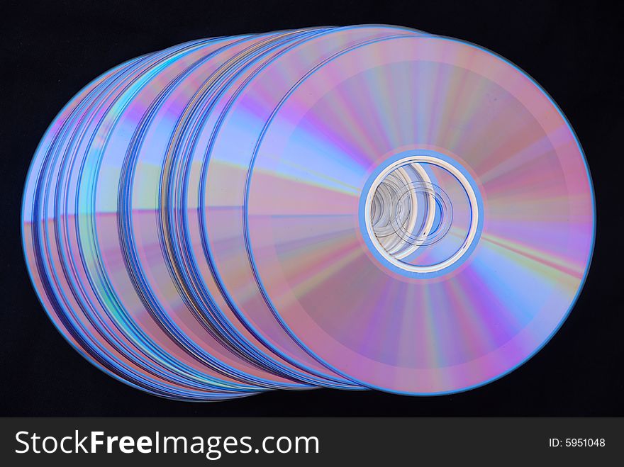 Arrangement of cd's on black background. Arrangement of cd's on black background