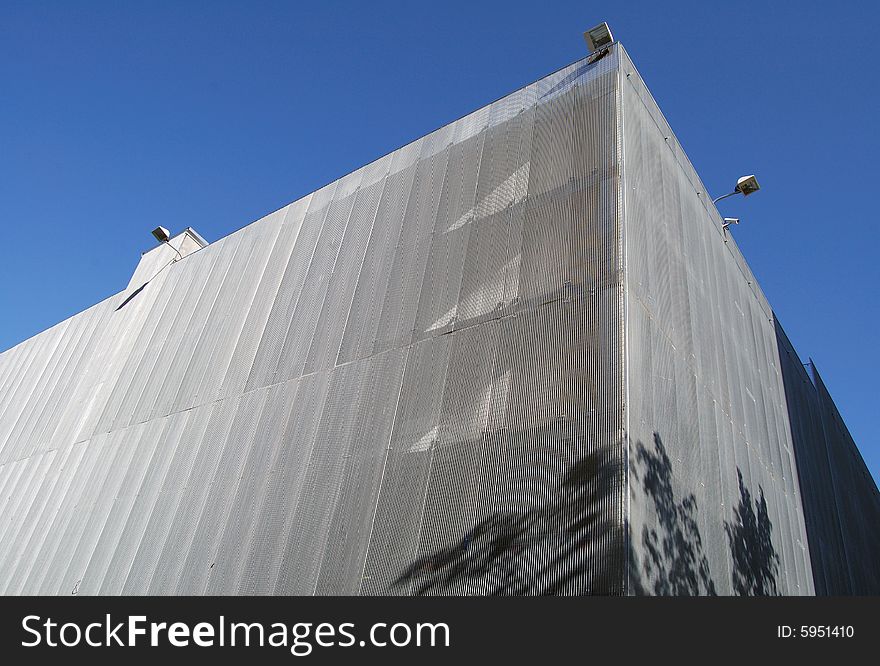 Modern car parking building and blue sky. Modern car parking building and blue sky