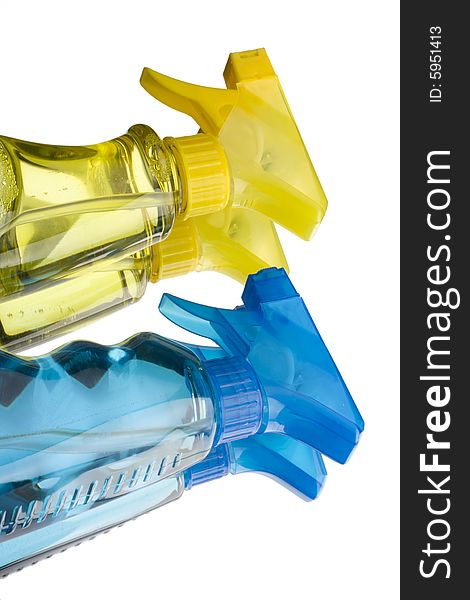 Blue and yellow trigger spray bottles