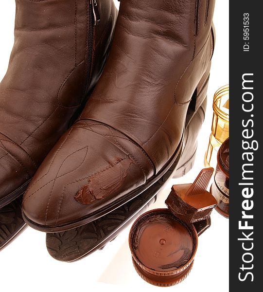 A pair of Brown boots polished to shine