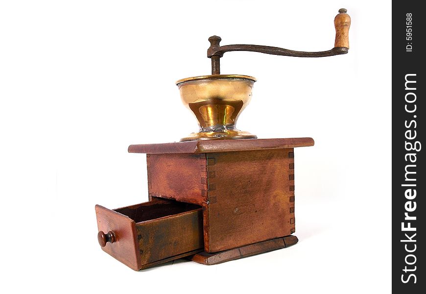 An old antique, wooden coffeemill. Shot taken from a 2/3 perfective on a white background. Use for grinding fresh coffeebeans