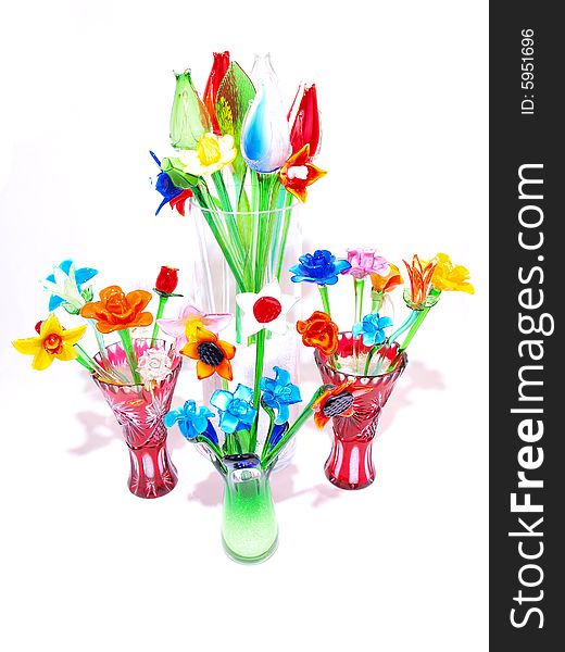 Grouped colorful crystal flowers in vases variety. Grouped colorful crystal flowers in vases variety