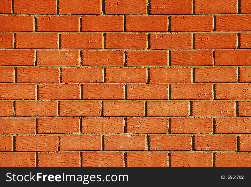 Orange, a new brick wall, fence