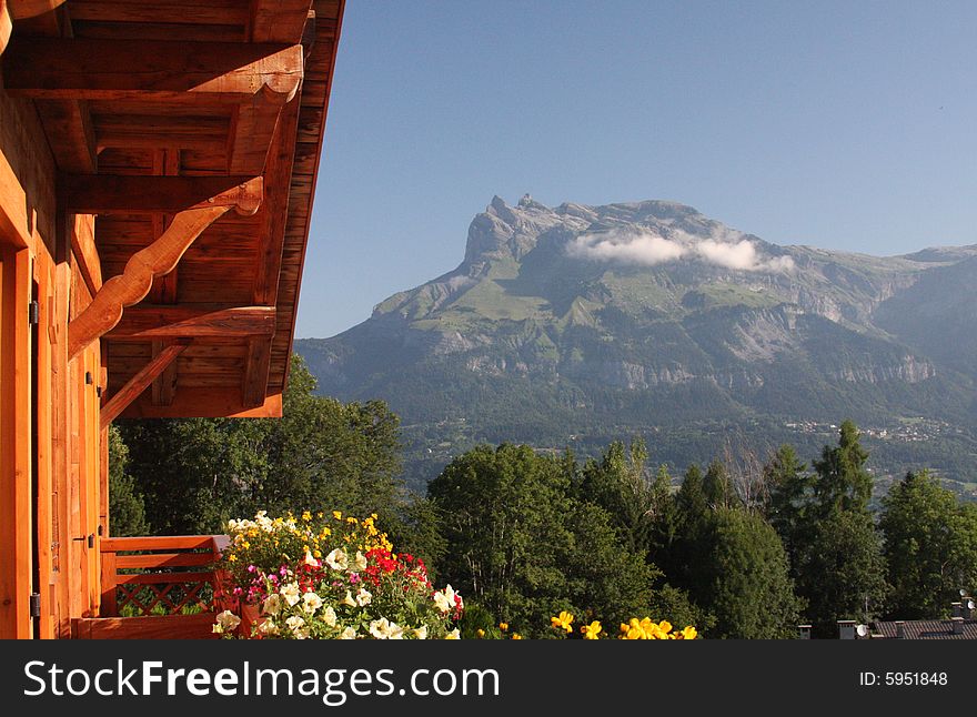 A chalet in the mountains near Mont Blanc catching the evening sun on its balcony. A chalet in the mountains near Mont Blanc catching the evening sun on its balcony