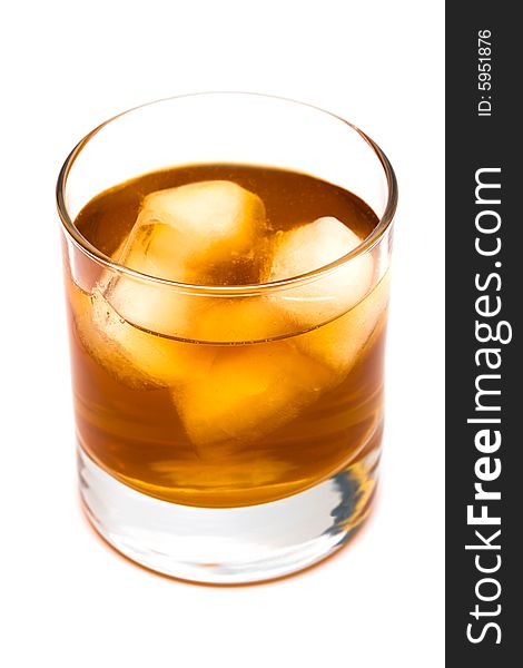 Glass of whisky with an ice on a white background