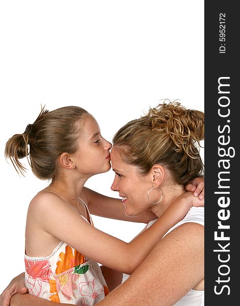 Daughter kissing mother on forehead