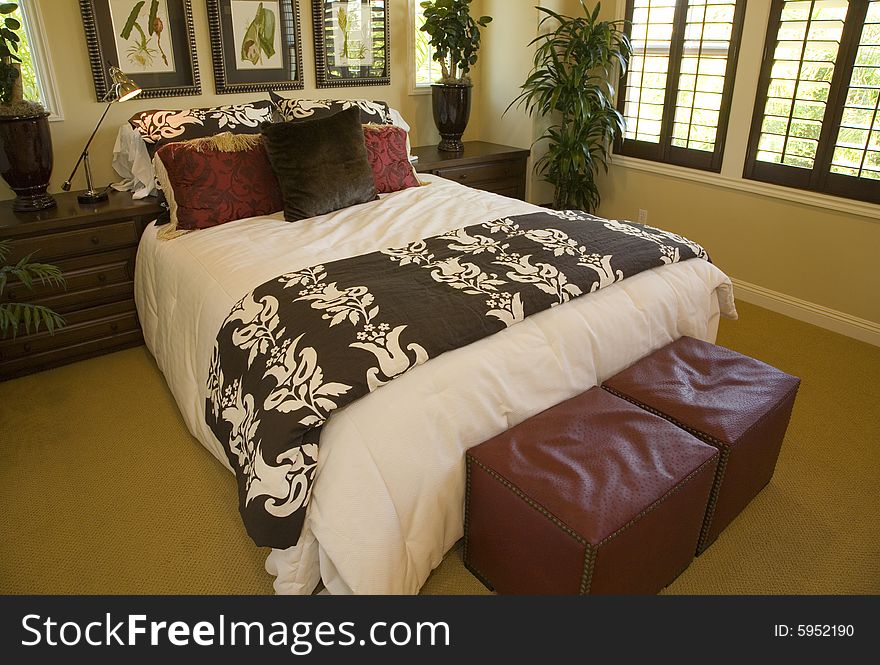 Designer bedroom with contemporary furniture and decor. Designer bedroom with contemporary furniture and decor.