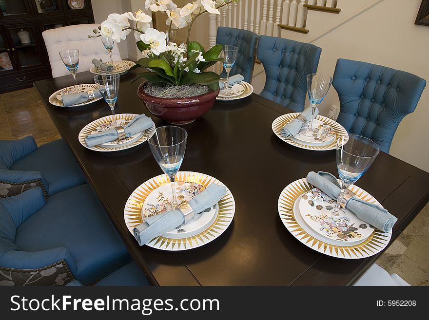 Dining table with modern tableware and decor. Dining table with modern tableware and decor.