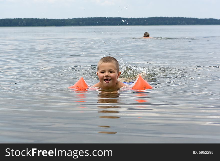 Small swimmer, color photo executed in poland