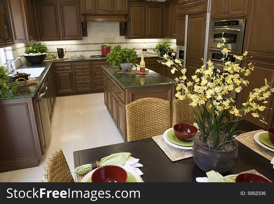 Decorated table with kitchen in the background. Decorated table with kitchen in the background.