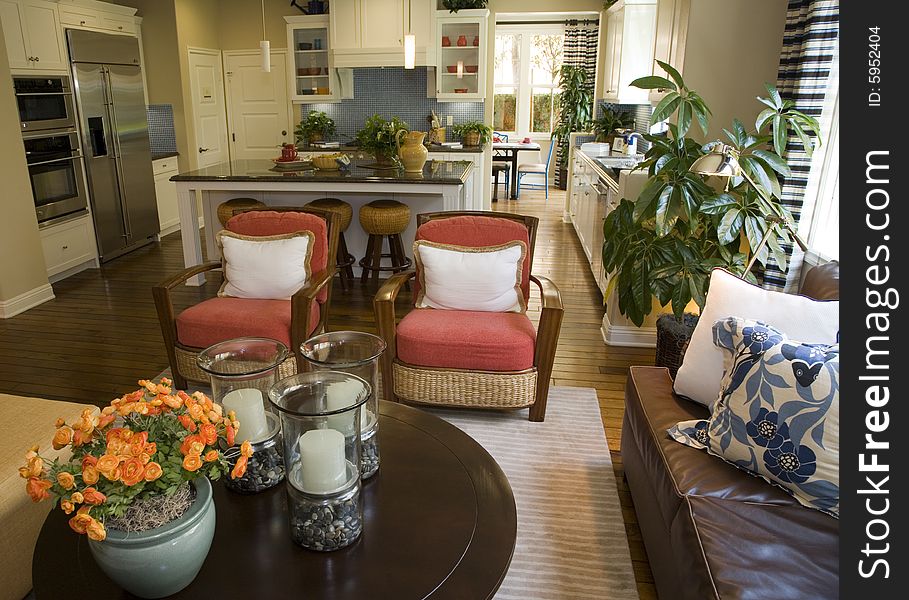 Living room with kitchen in the background. Living room with kitchen in the background.