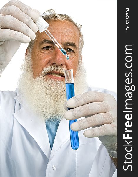 Mature scientist in laboratory holiding pipette and test tube with blue liquid isolated on white