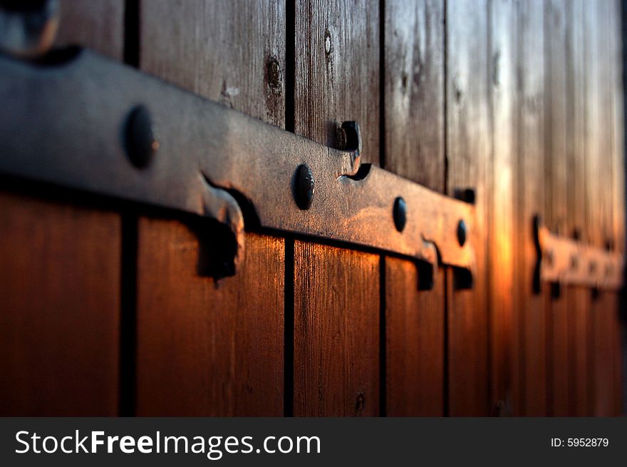 Wooden windows in the sunset.A typical sunset in Puyricard  , the soft sunshine paint a beautiful colour on the windows.