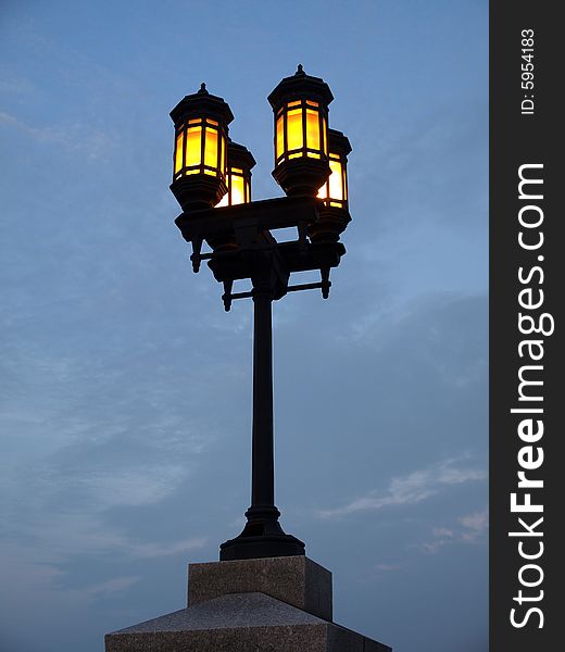 Four Yellow Lamp Streetlight against blue sky. Four Yellow Lamp Streetlight against blue sky