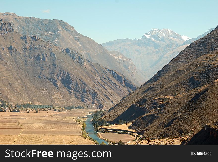 The sacred valley is located in peru, its fertile farmland and snowcapped andes are visible. The sacred valley is located in peru, its fertile farmland and snowcapped andes are visible