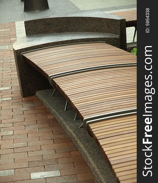 Modern Design Wooden Slat Sitting Bench on bricks. Modern Design Wooden Slat Sitting Bench on bricks