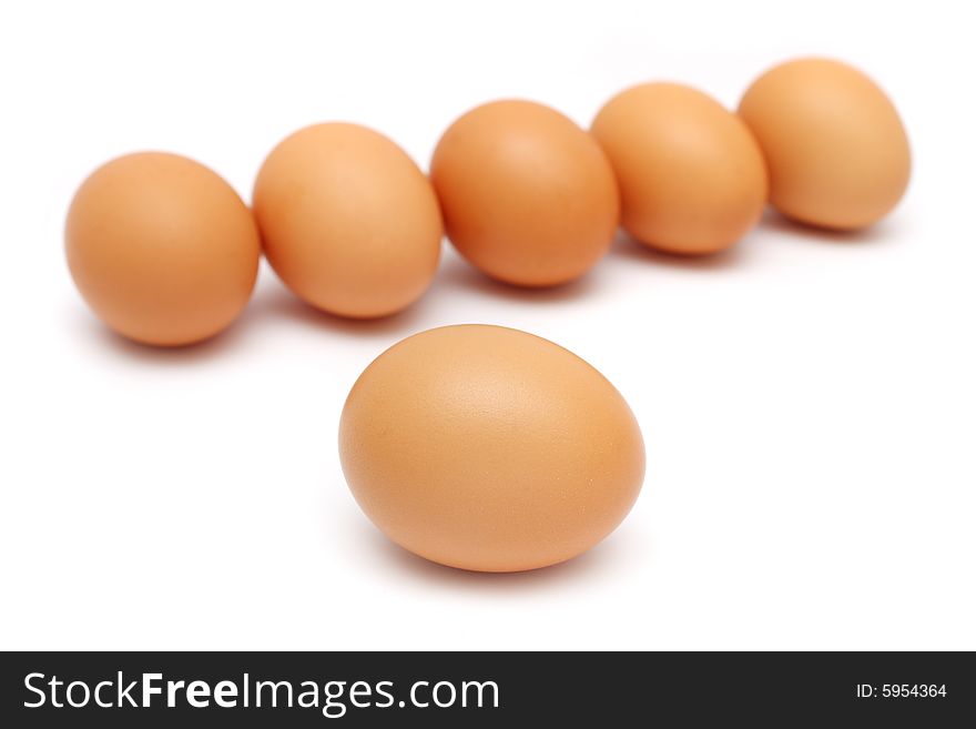 An egg isolated from the others over white background. An egg isolated from the others over white background.