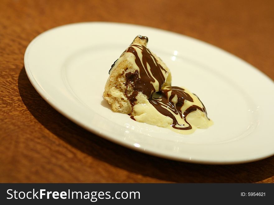 Bread pudding with chocolate on plate