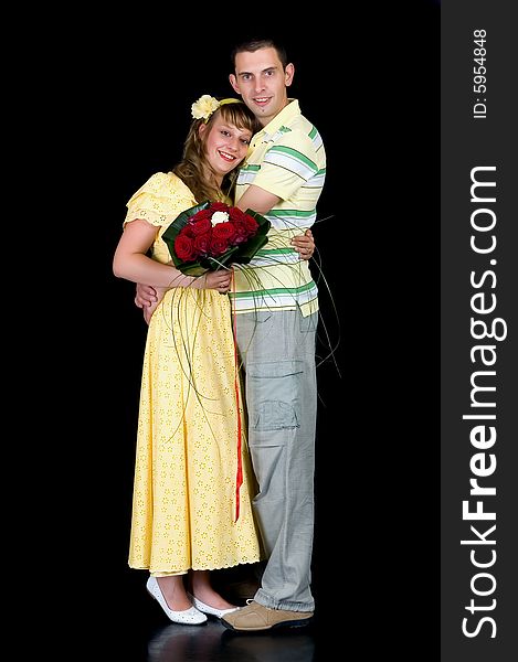 Young happy laughing wedding couple on black background, studio shot. Young happy laughing wedding couple on black background, studio shot