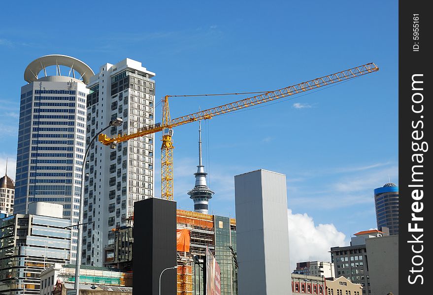 Construction crane with modern building background