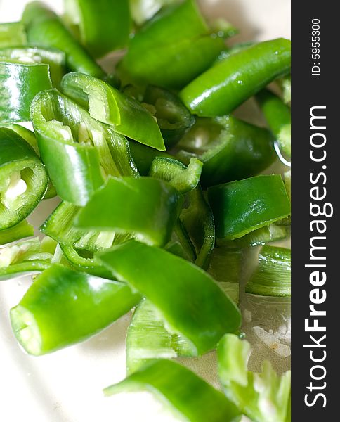 Fresh sliced green pepper in white plate