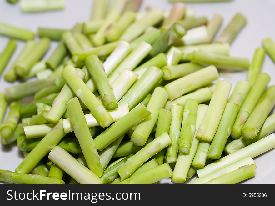 Green fresh bamboo shoot cut in white plate