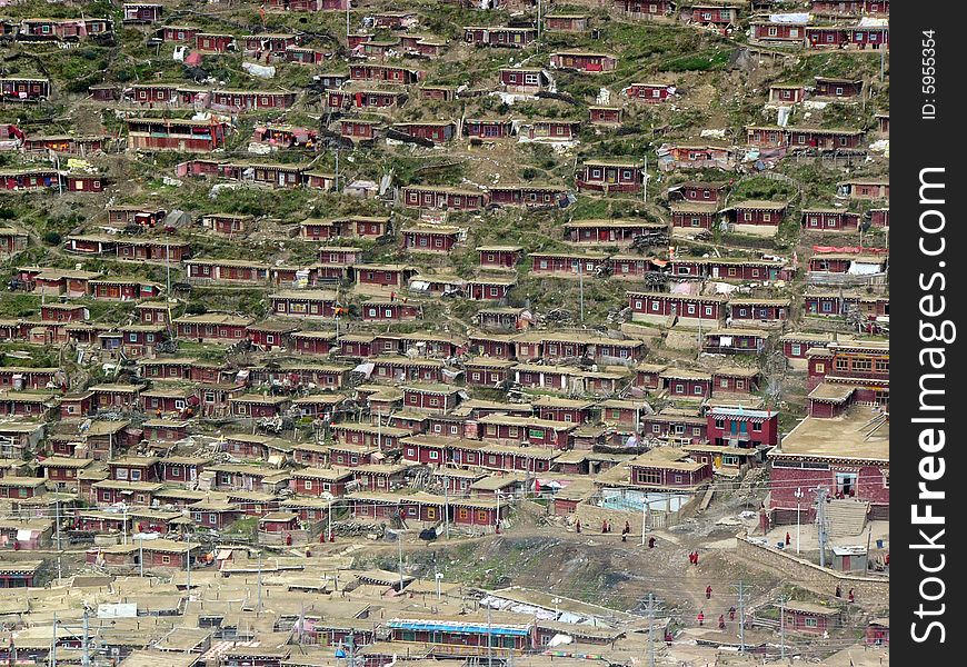 One side of the buddhism college in west of China.It is a secret and saintly place which buddhist attending in a advanced studies.Also it is amazing to see so many house built around the mountain.