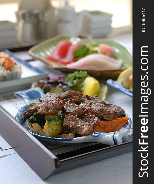 Japanese seasoned beef and vegetables with sushi