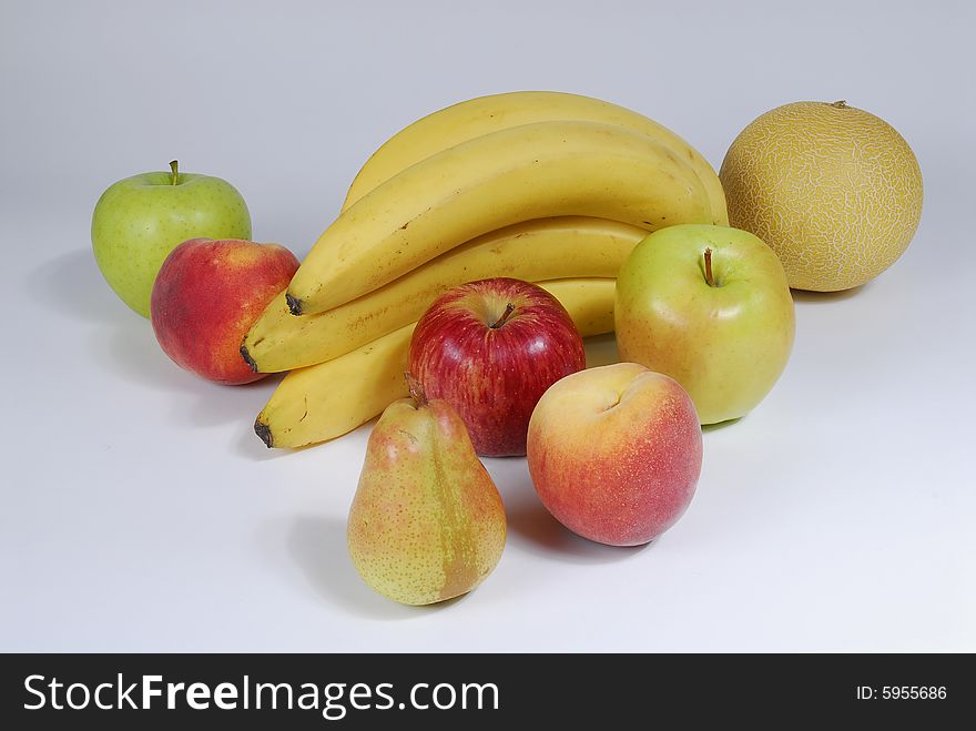 Beautiful natural fruit - bananas, meloa, peaches, pears,apples