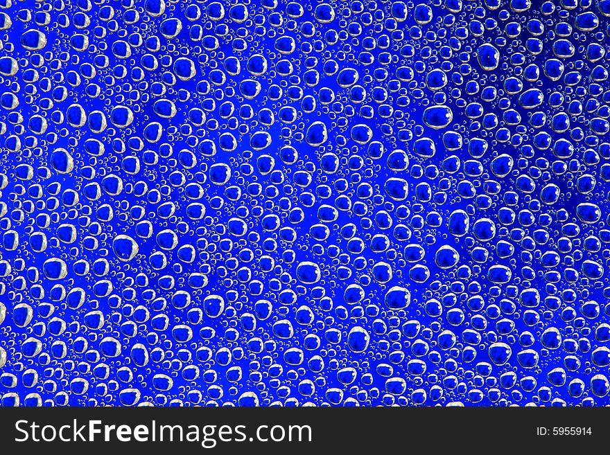 Drops of water on a blue background. Drops of water on a blue background.
