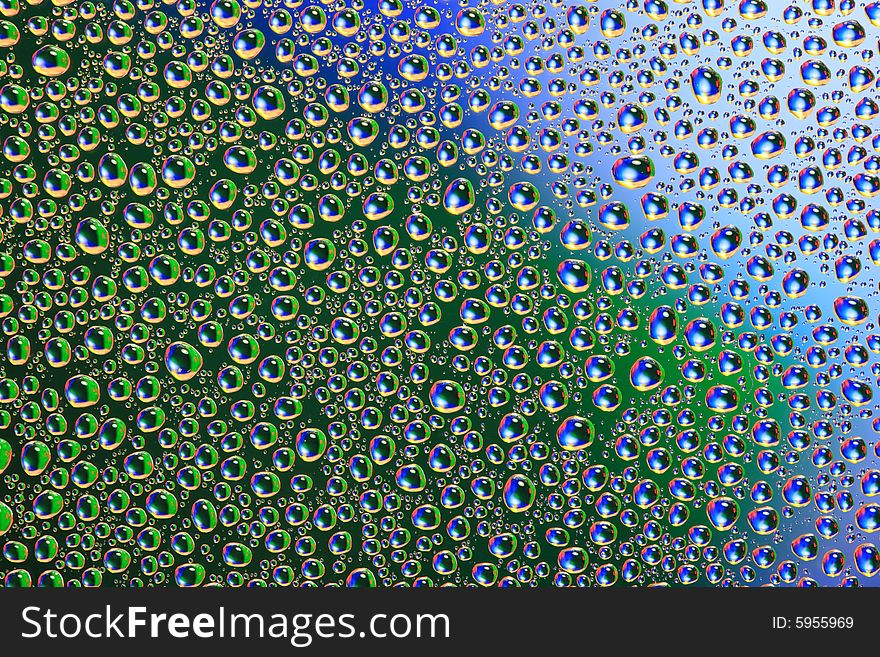 Drops of water on a blue, green background. Drops of water on a blue, green background.