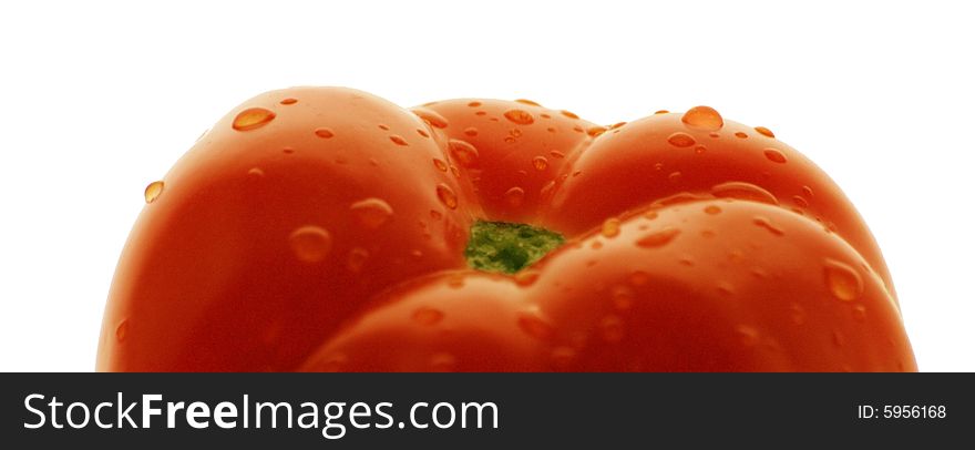 The ripe tomato, covered with droplets of juice. Situated on a white background. The ripe tomato, covered with droplets of juice. Situated on a white background.