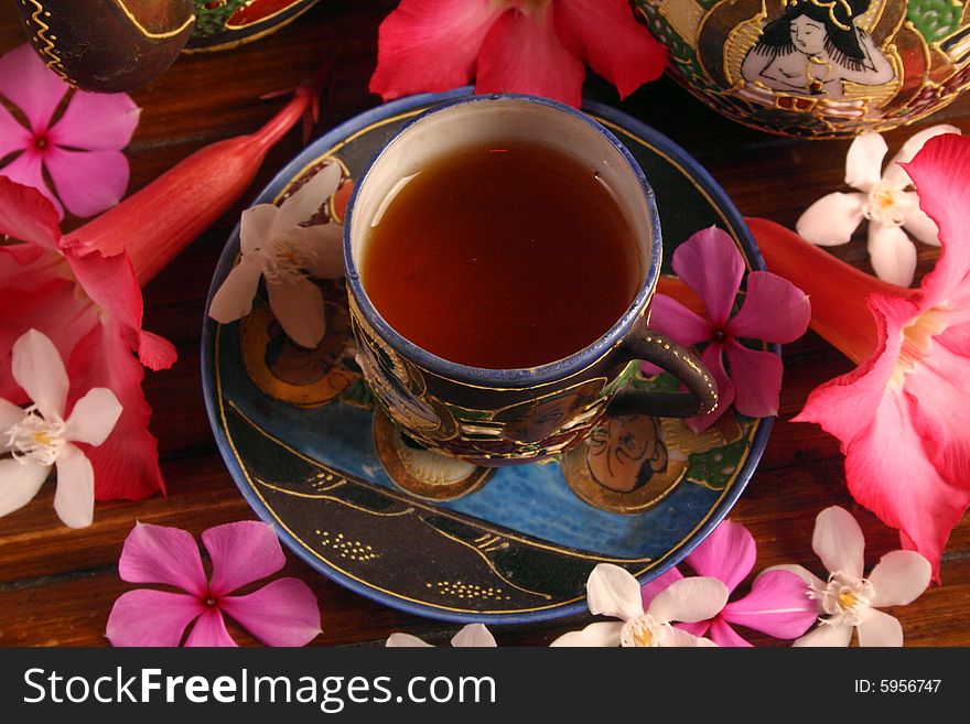 Cup of tea with tropical flowers. Cup of tea with tropical flowers