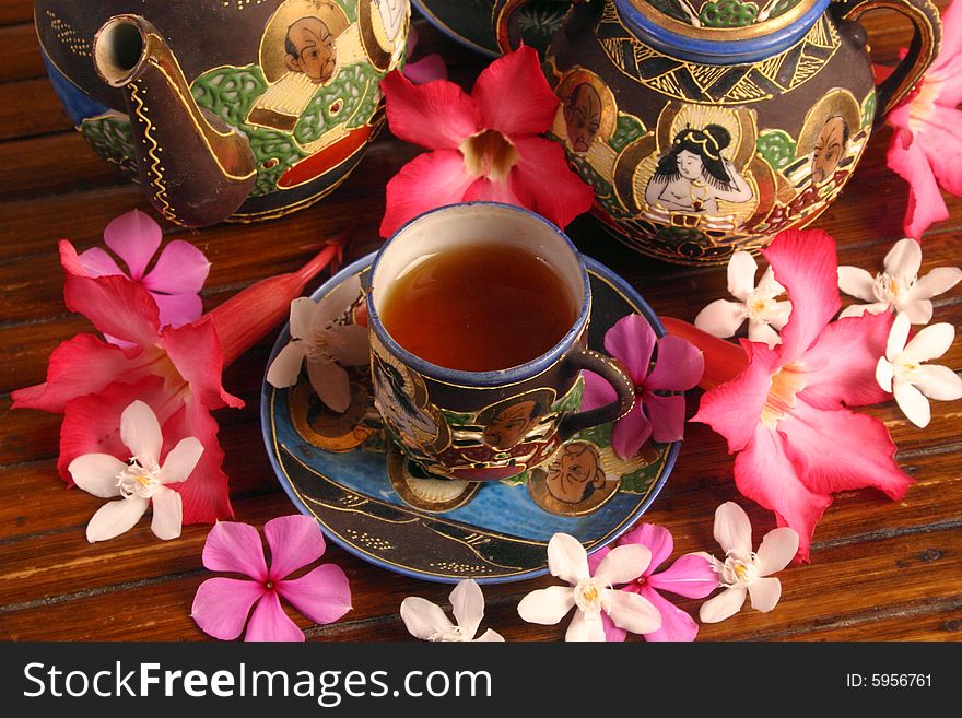 Cup of tea with tropical flowers. Cup of tea with tropical flowers