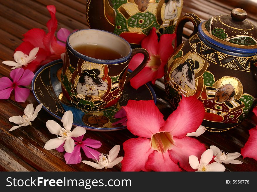 Cup of tea with tropical flowers. Cup of tea with tropical flowers