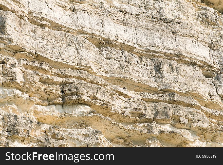 Rock wall texture material, suitable as background. Rock wall texture material, suitable as background