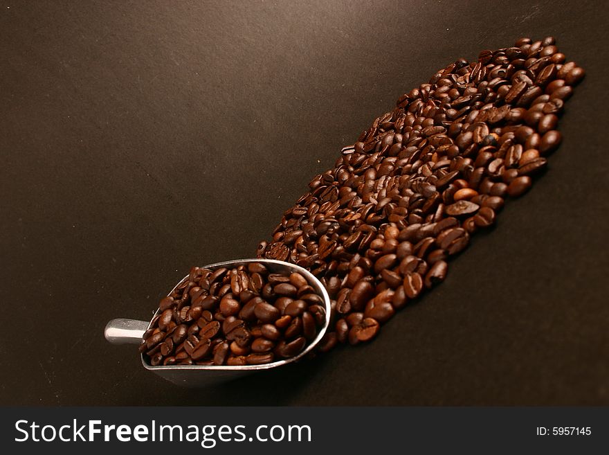 Coffee beans and scoop