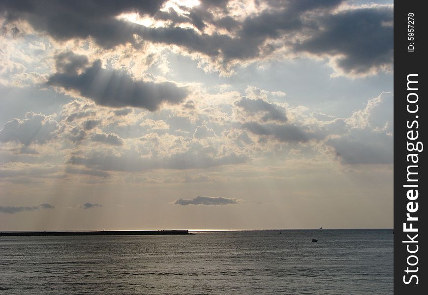 Sunset on the seaside with clouds and sea. Sunset on the seaside with clouds and sea