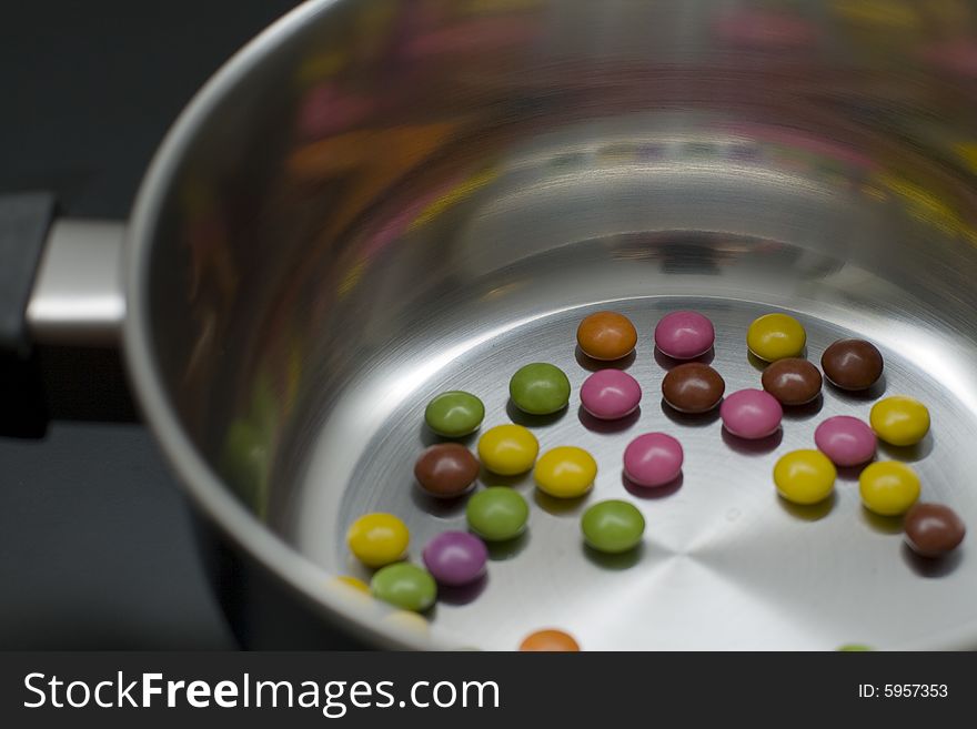 Colored pills in a silver pan. Colored pills in a silver pan