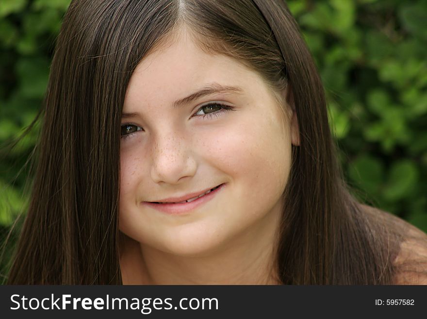 Beautiful brunette girl with long bangs