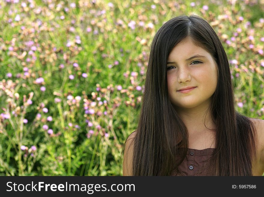 Beautiful brunette girl with long hair and sad expression