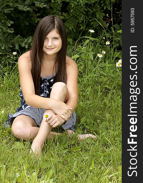 Beautiful brunette girl sitting in the park. Beautiful brunette girl sitting in the park